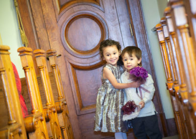 A photograph of the flower girl and the ring bearer before the wedding.