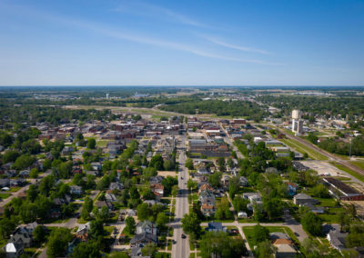 A drone photograph of a small Midwestern town on a Spring day.