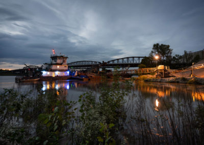 An evening photo of boats on the river.