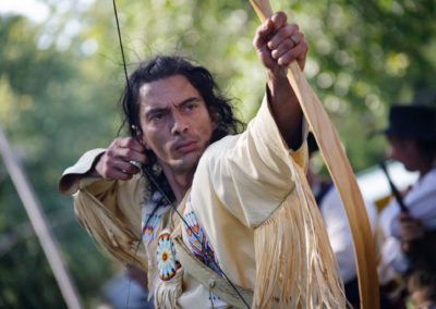 A reenactor demonstrates his archery technique.