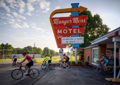 Riders leave the motel for the bike ride.