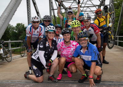 Riders pose on the bridge on old Route 66.