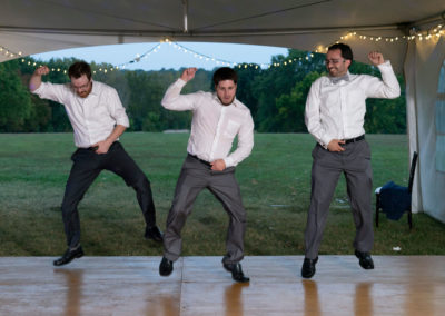 The groom and the groomsmen dancing at the wedding reception.