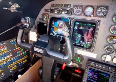 A cockpit photo with the yoke and flight instruments.